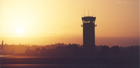 photo of the outside of the airport at sunset.